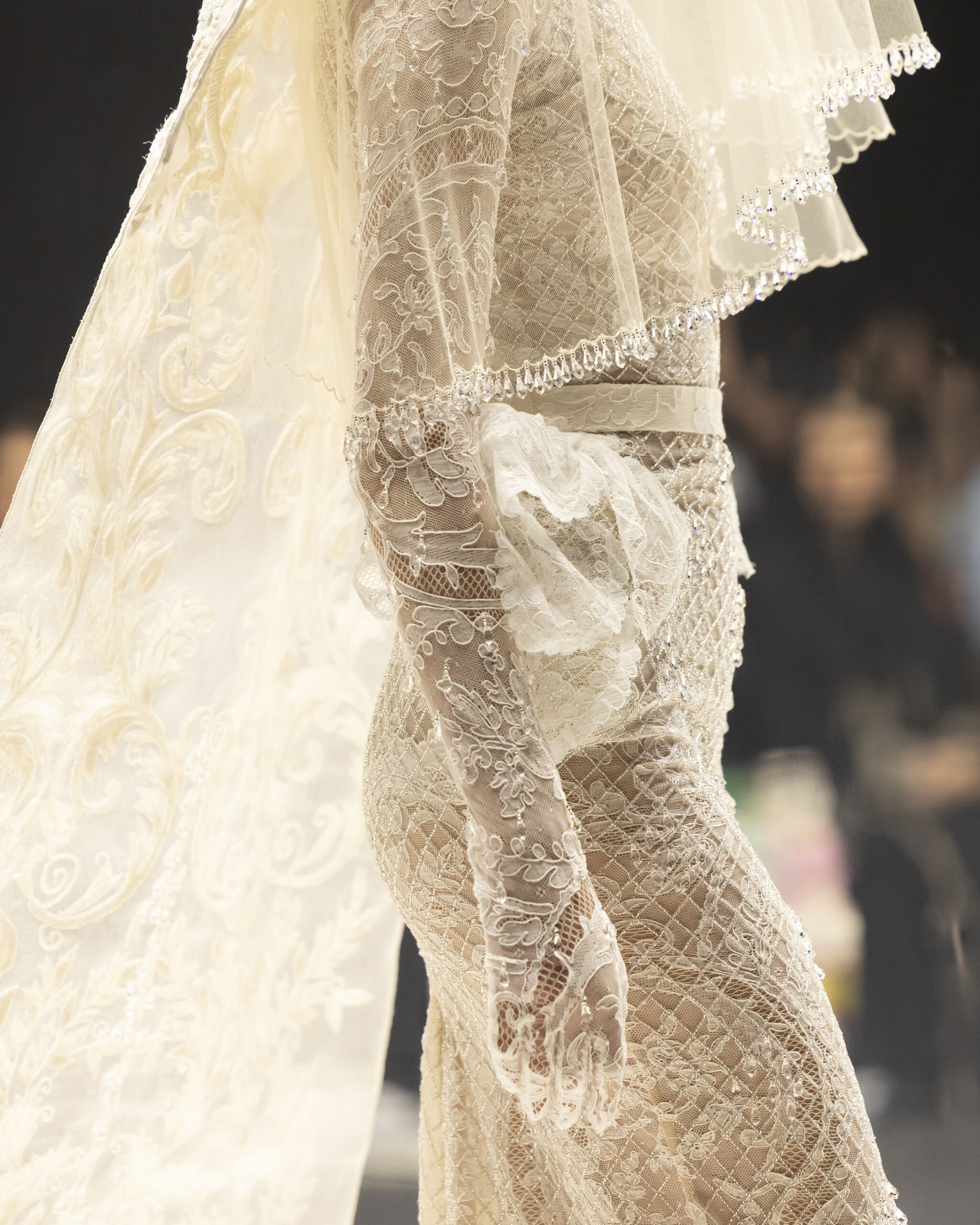 Models showcasing Saudi couture at Riyadh Fashion Week, blending tradition and modernity.