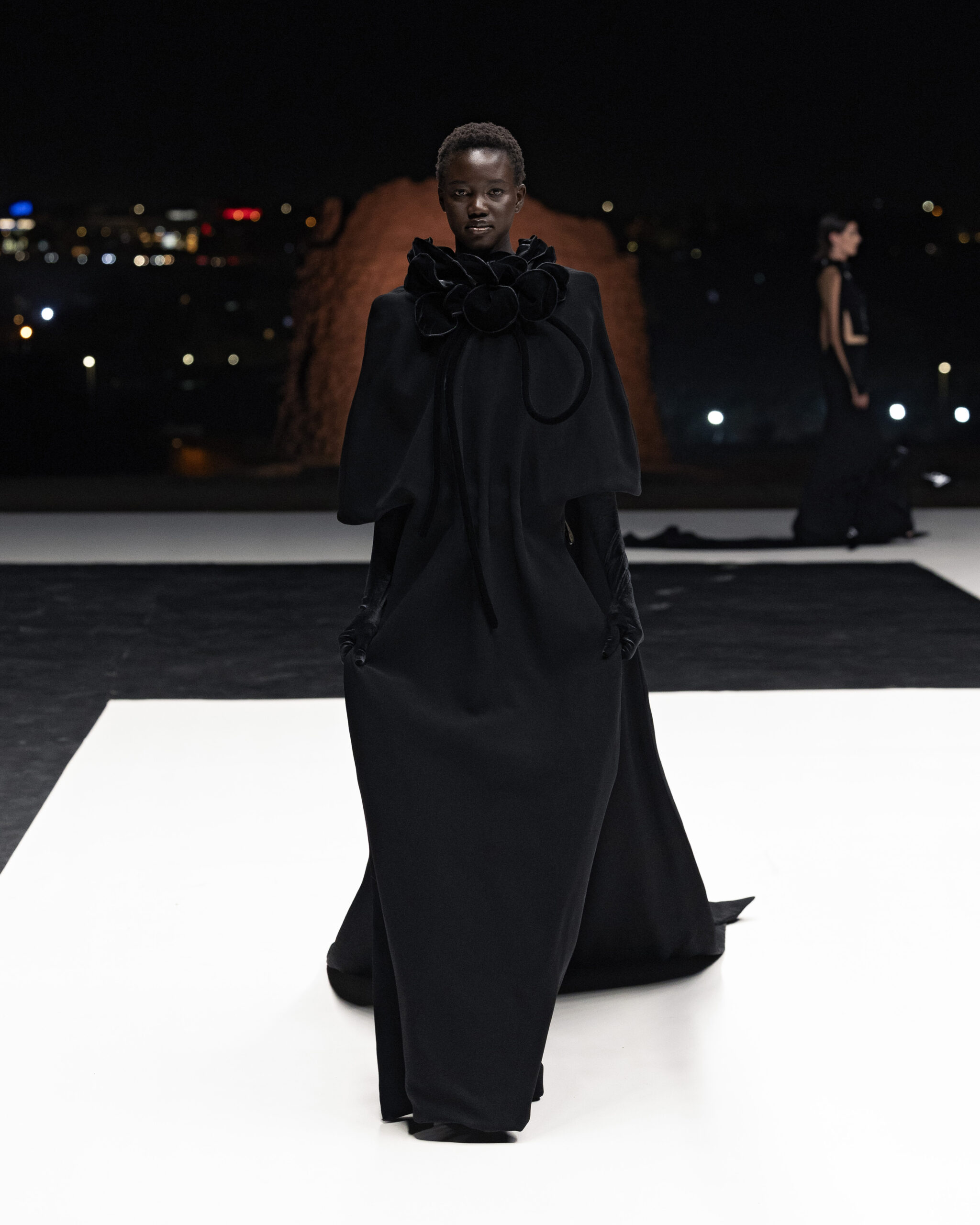 Models showcasing Saudi couture at Riyadh Fashion Week, blending tradition and modernity.