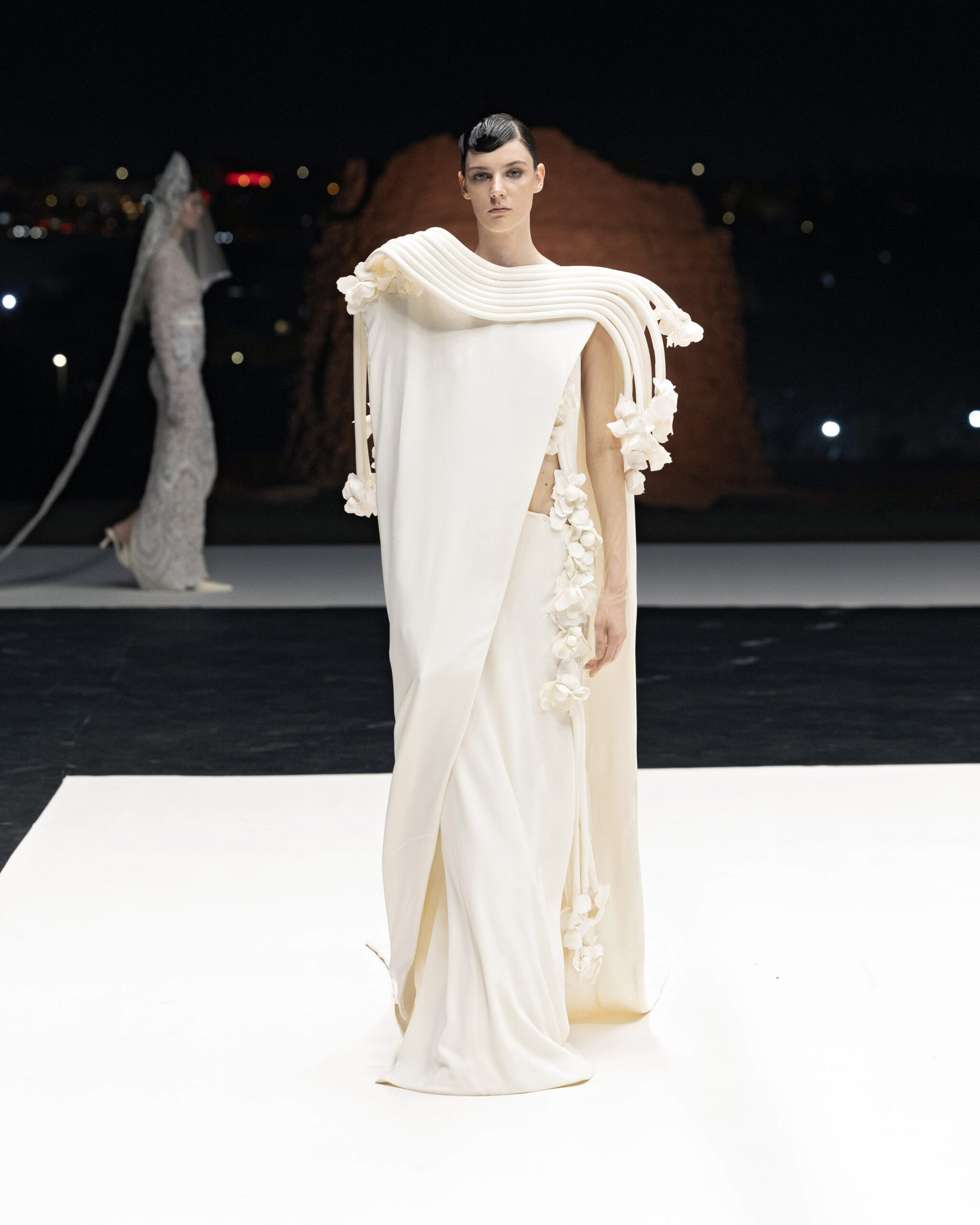 Models showcasing Saudi couture at Riyadh Fashion Week, blending tradition and modernity.