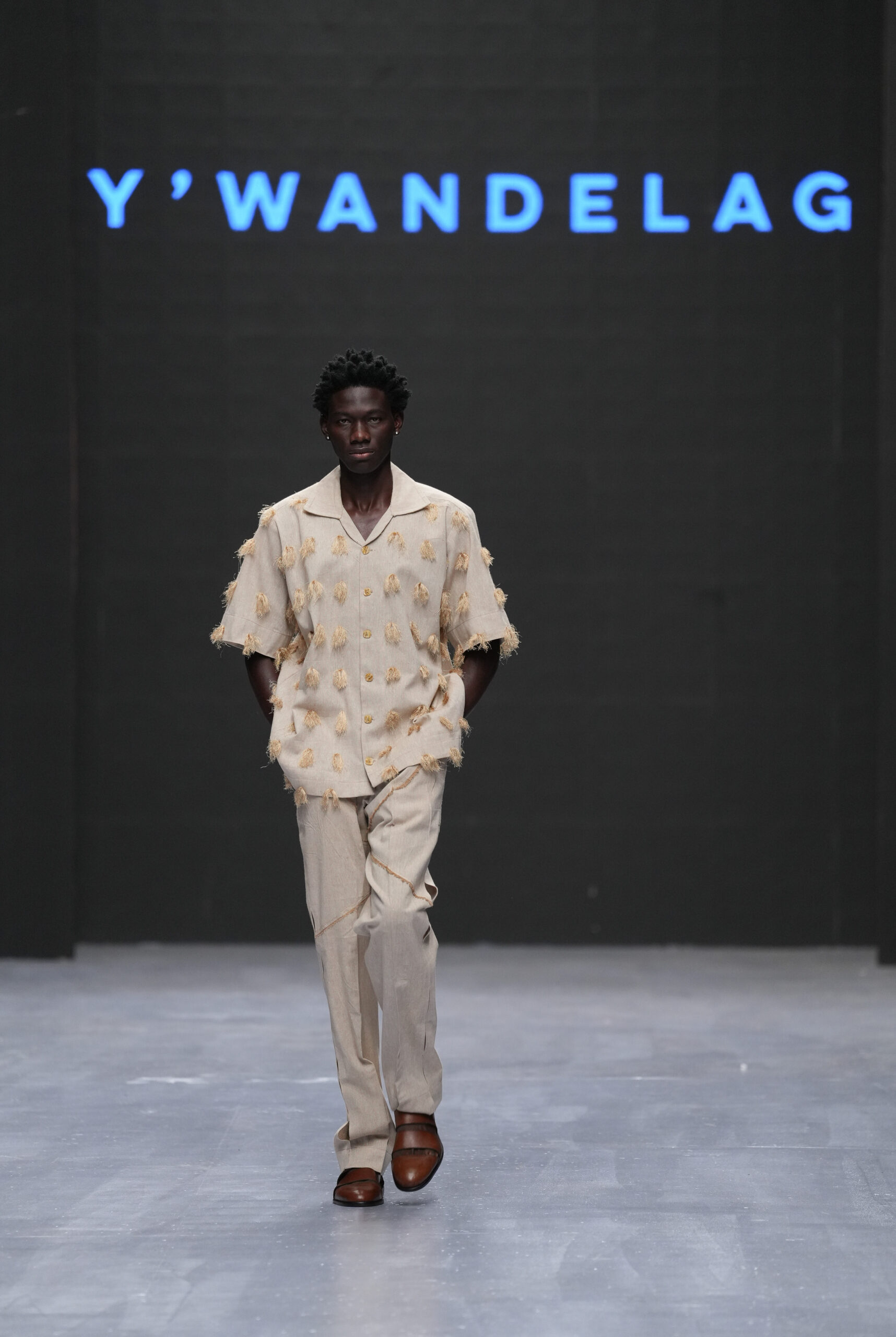 Models on Lagos Fashion Week 2024 runway, showcasing Nigerian designs with African textiles and vibrant street style.