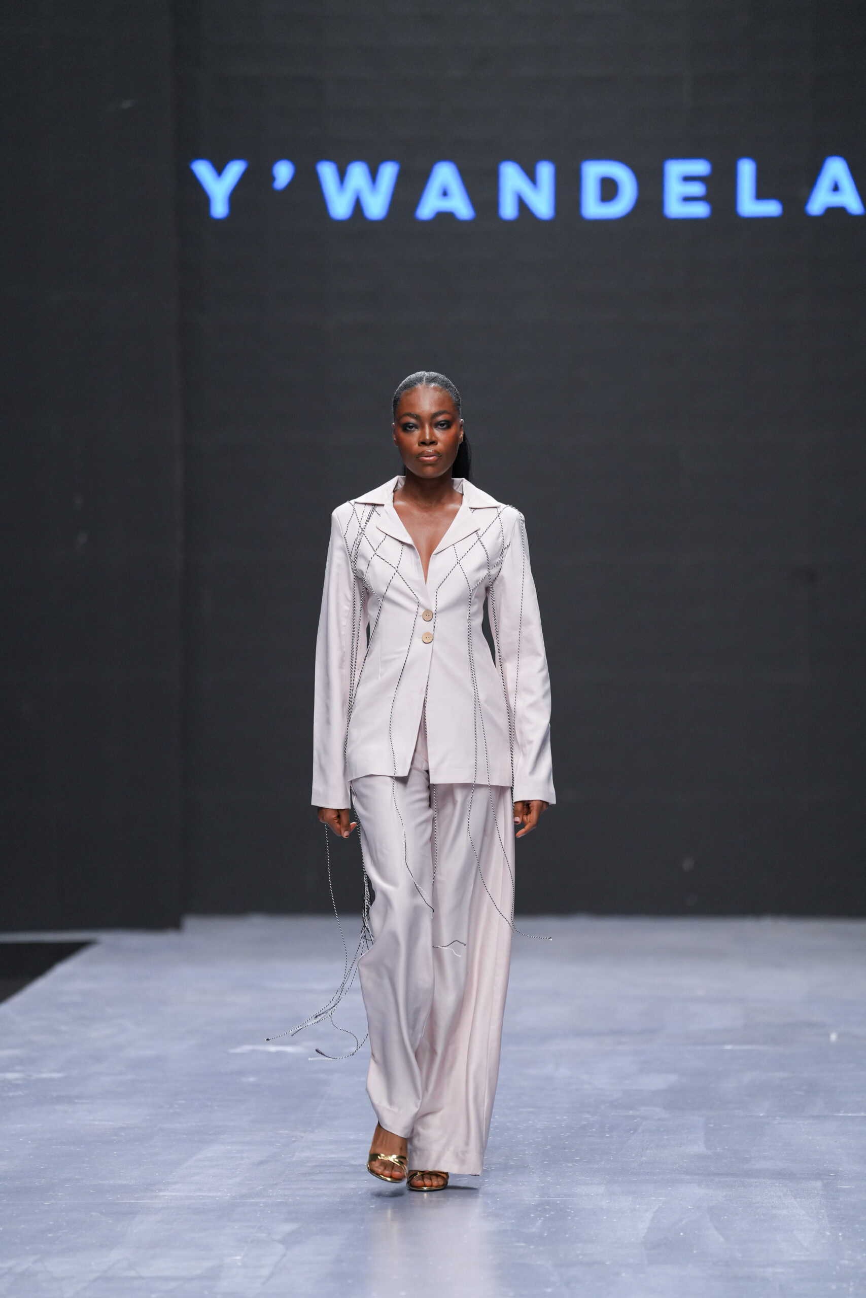 Models on Lagos Fashion Week 2024 runway, showcasing Nigerian designs with African textiles and vibrant street style.