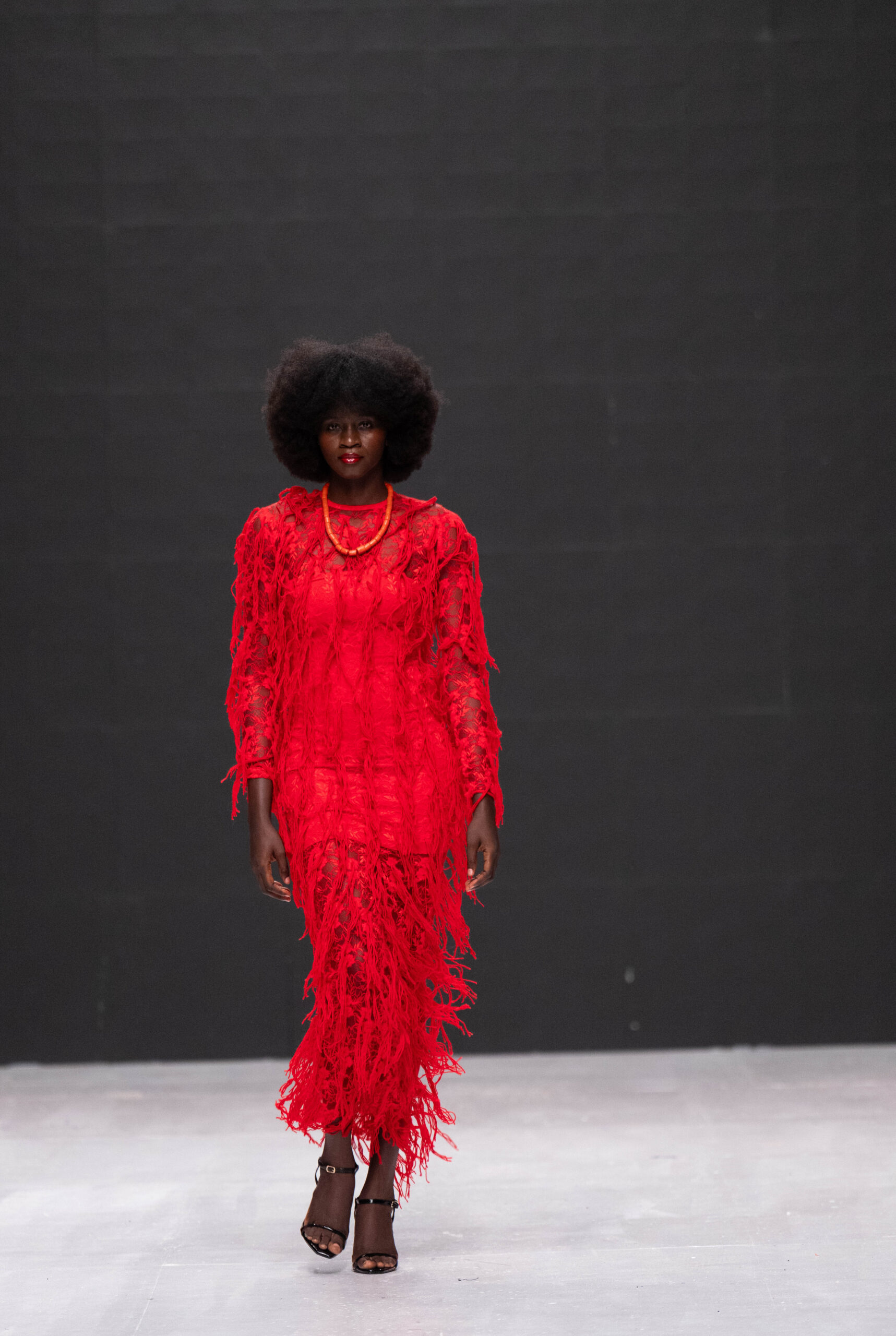 Models on Lagos Fashion Week 2024 runway, showcasing Nigerian designs with African textiles and vibrant street style.
