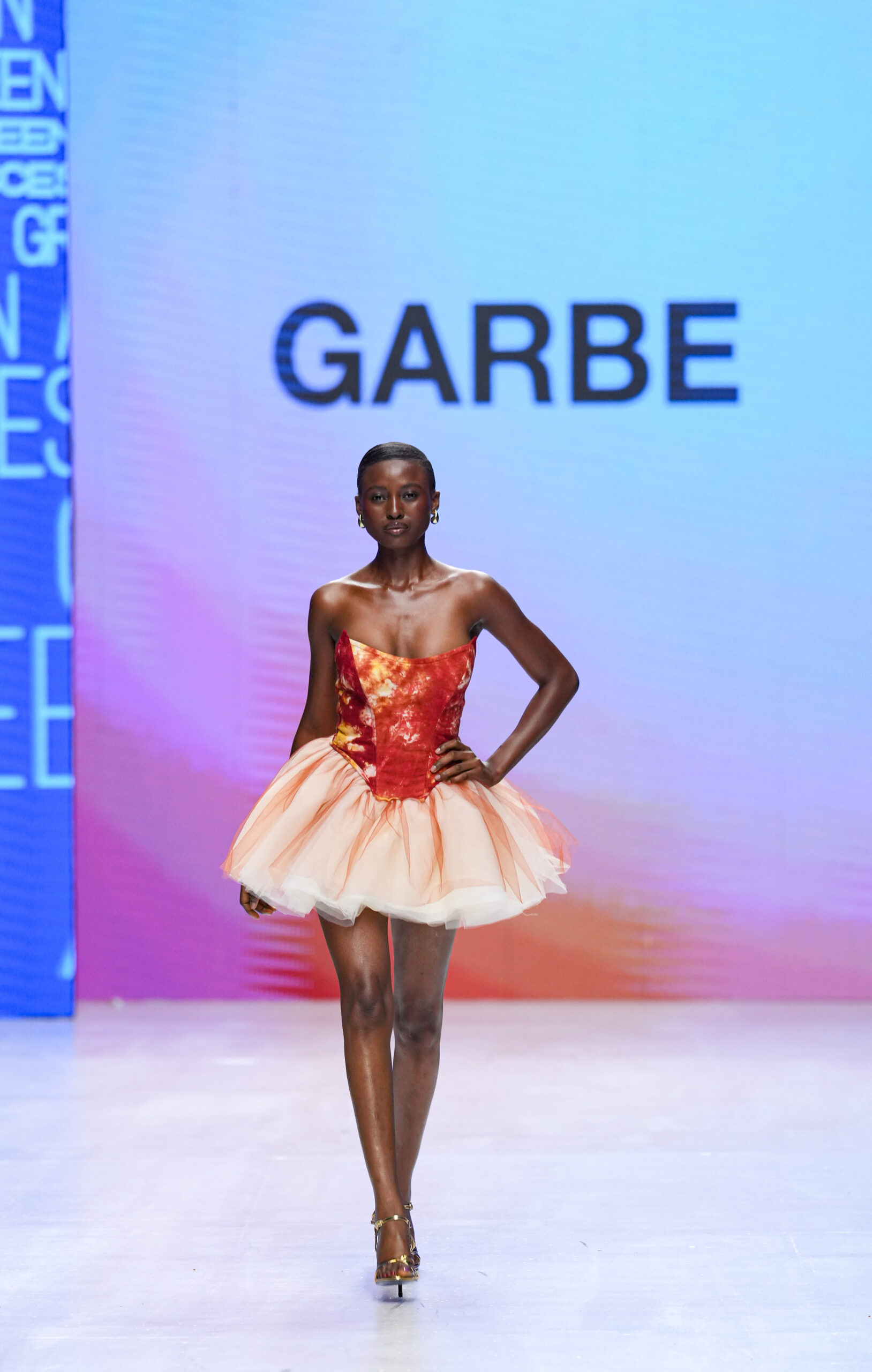 Models on Lagos Fashion Week 2024 runway, showcasing Nigerian designs with African textiles and vibrant street style.