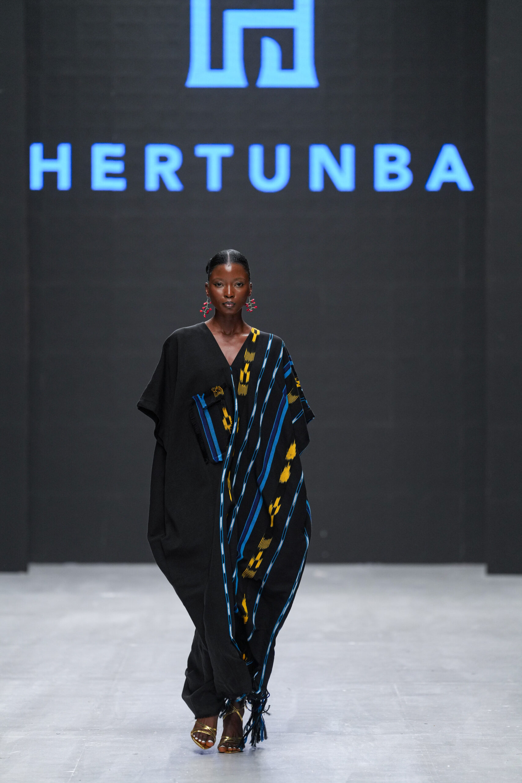 Models on Lagos Fashion Week 2024 runway, showcasing Nigerian designs with African textiles and vibrant street style.