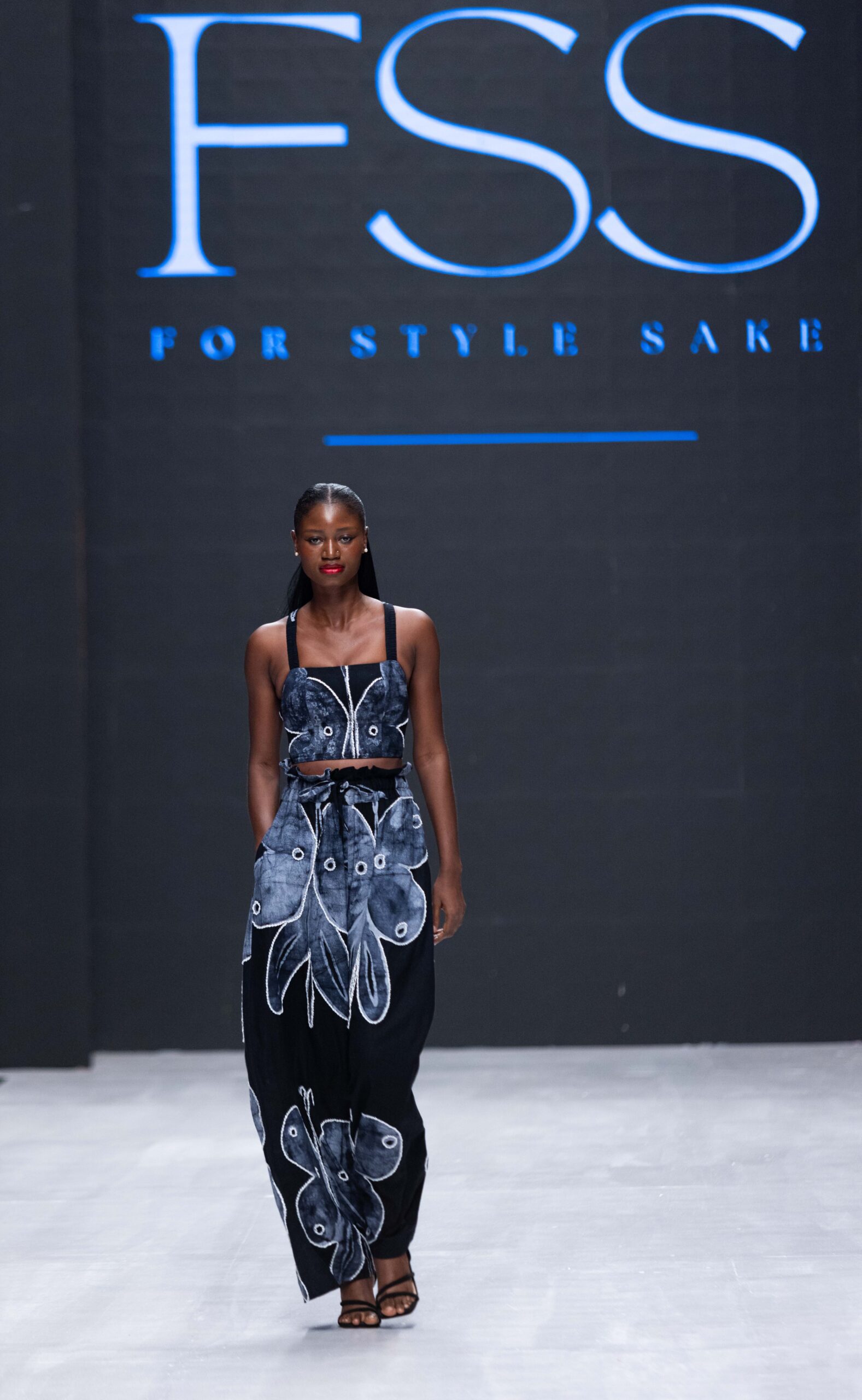Models on Lagos Fashion Week 2024 runway, showcasing Nigerian designs with African textiles and vibrant street style.