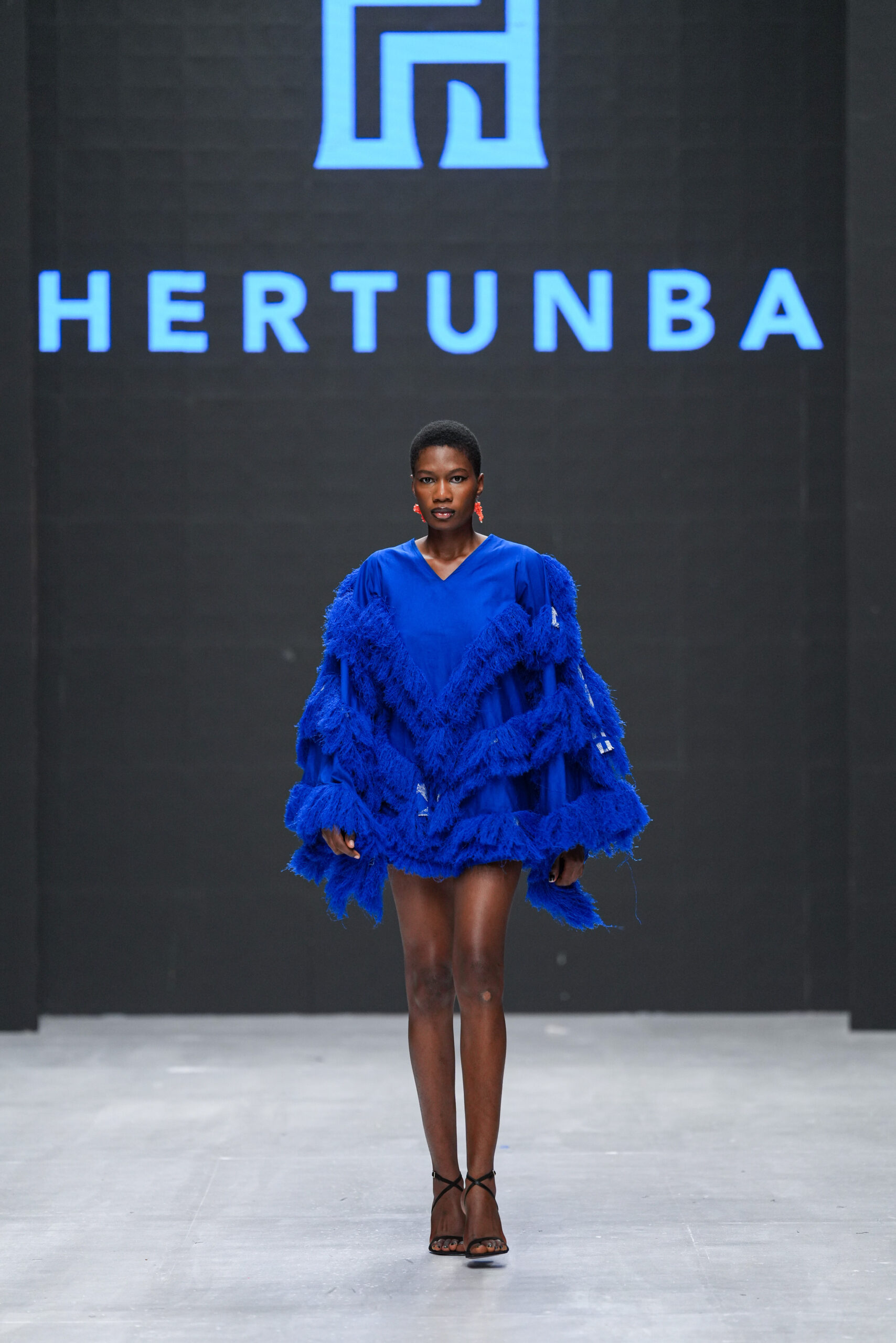 Models on Lagos Fashion Week 2024 runway, showcasing Nigerian designs with African textiles and vibrant street style.