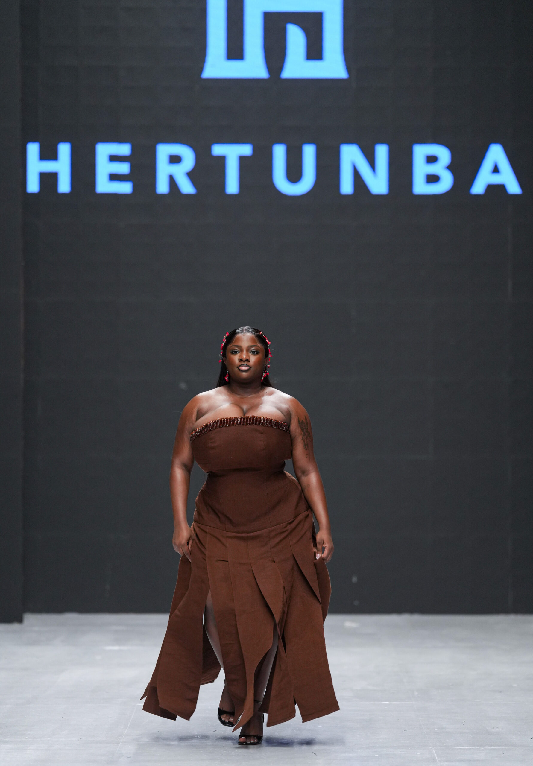 Models on Lagos Fashion Week 2024 runway, showcasing Nigerian designs with African textiles and vibrant street style.