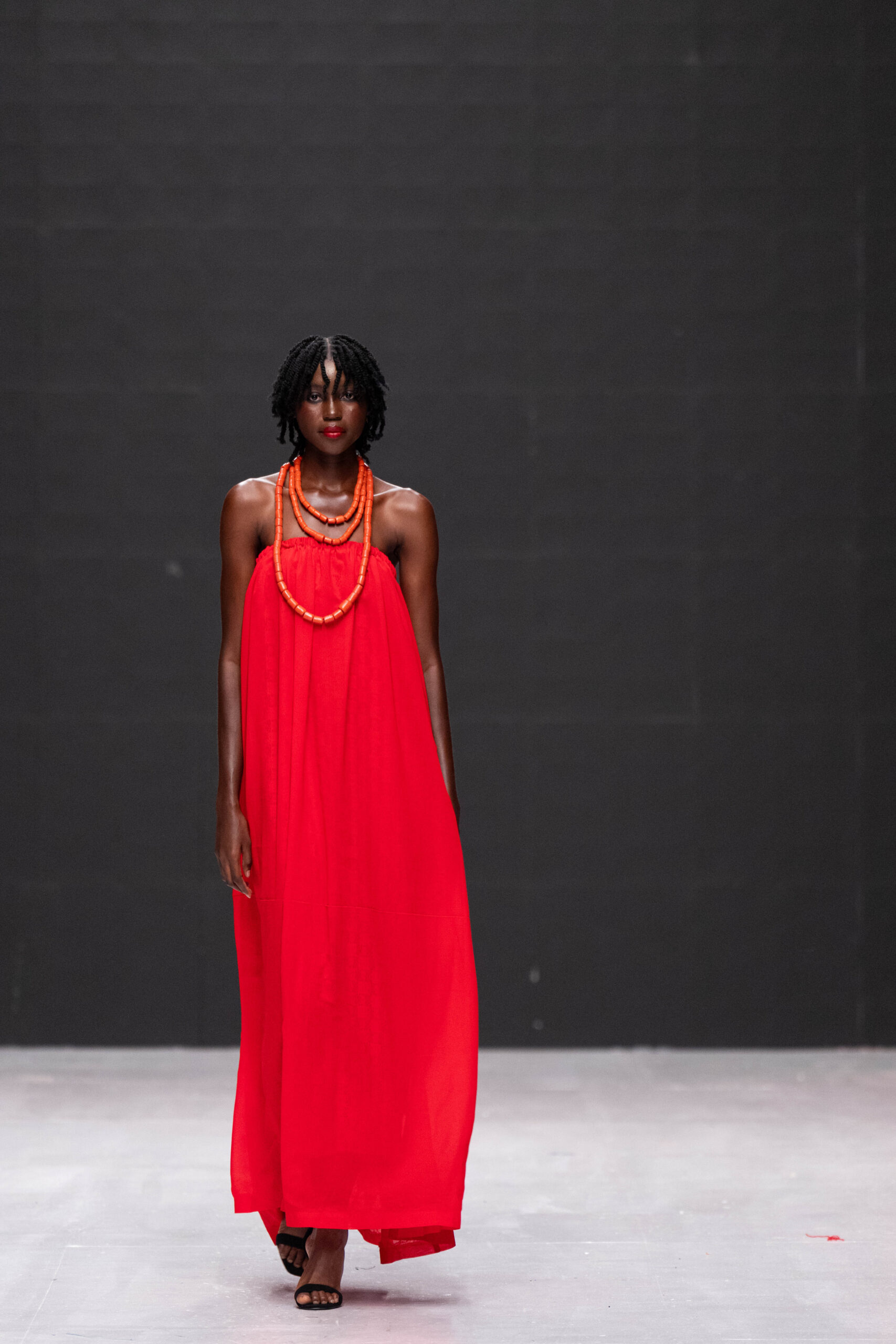 Models on Lagos Fashion Week 2024 runway, showcasing Nigerian designs with African textiles and vibrant street style.