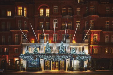 Tree Image: “Claridge’s 2024 Christmas tree designed by Paul Smith, featuring birdhouses with playful British details.