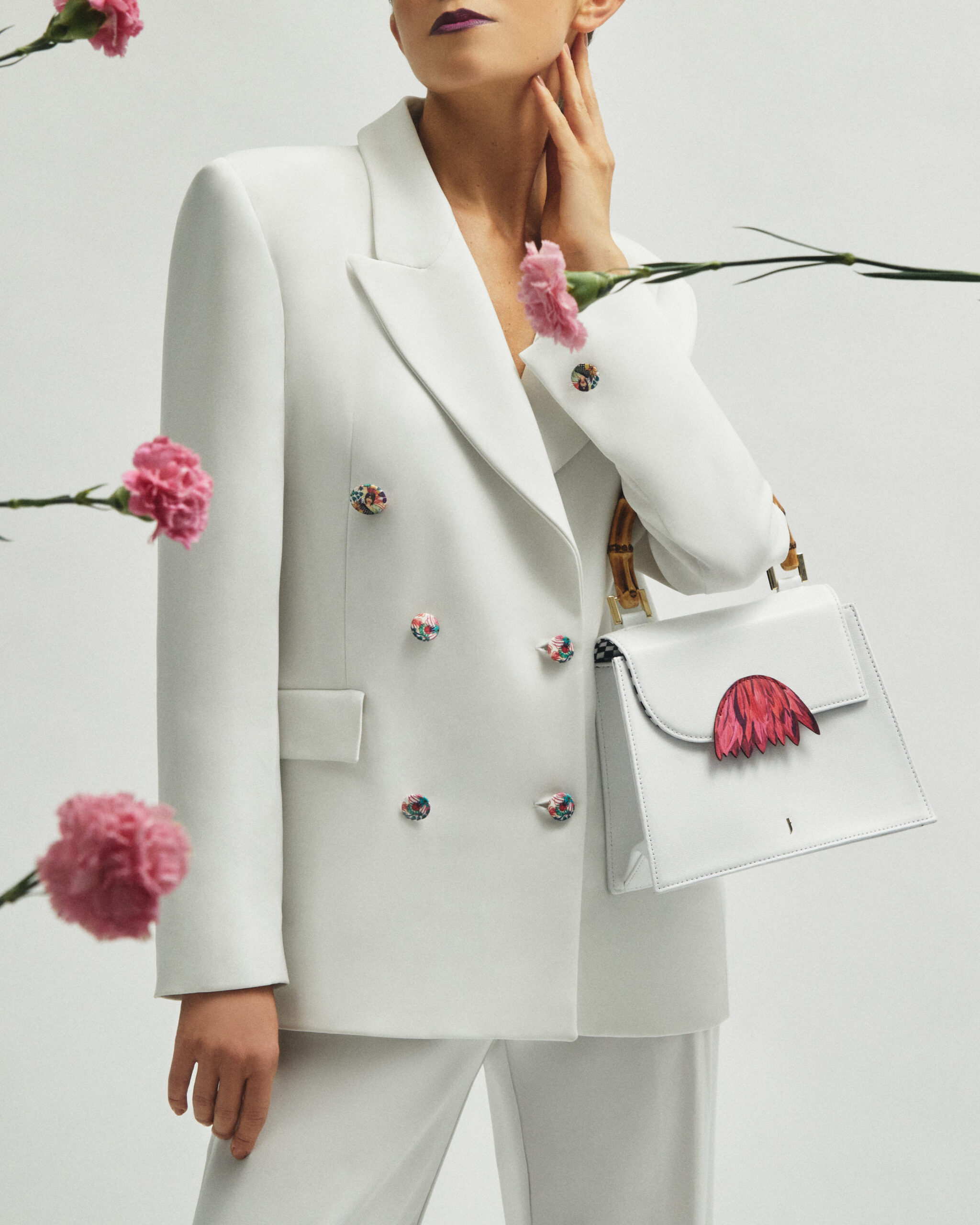 Luxury accessories showcasing fringes made from leather scraps, emphasizing J'ESSENTIA's commitment to sustainability.