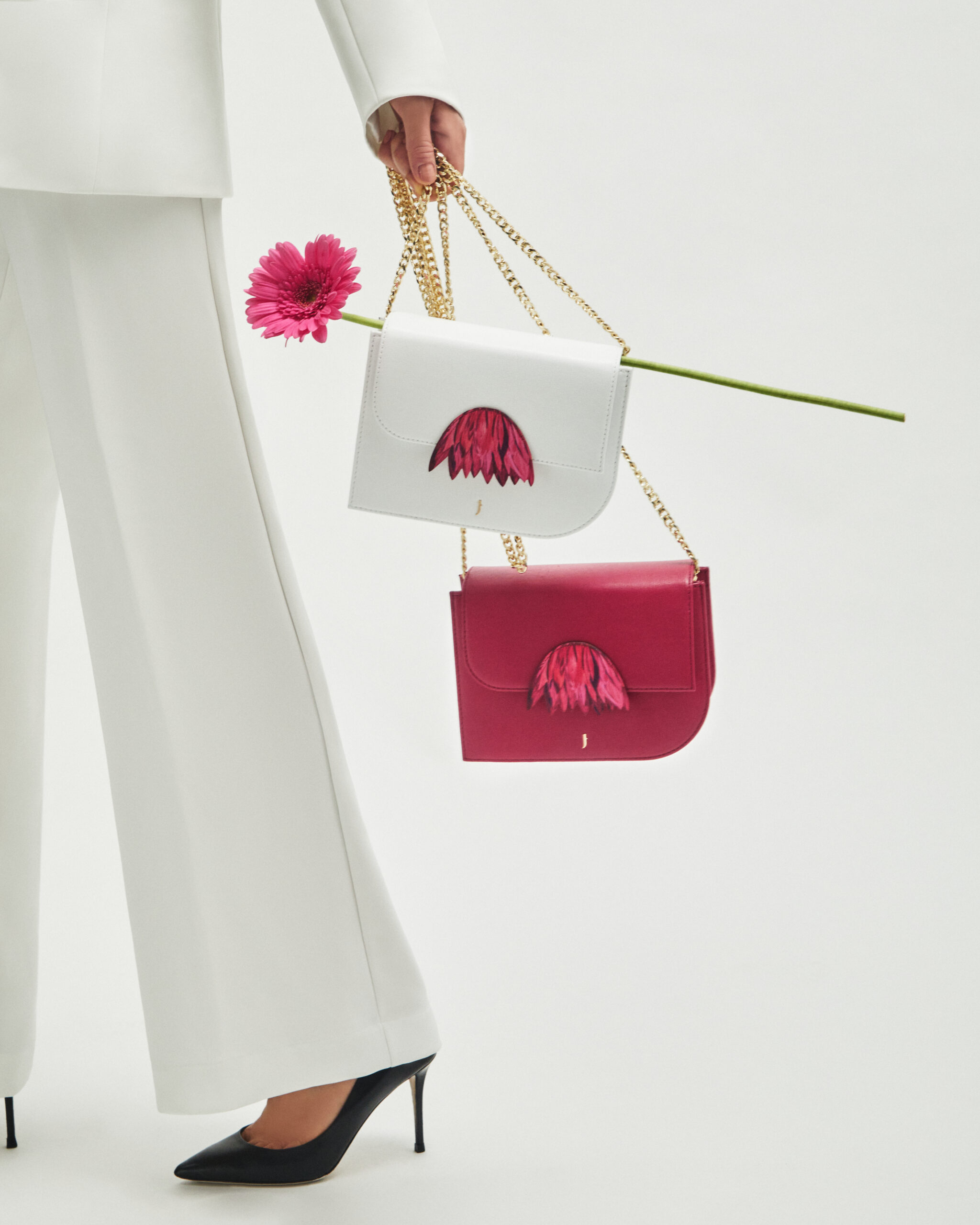 Luxury accessories showcasing fringes made from leather scraps, emphasizing J'ESSENTIA's commitment to sustainability.