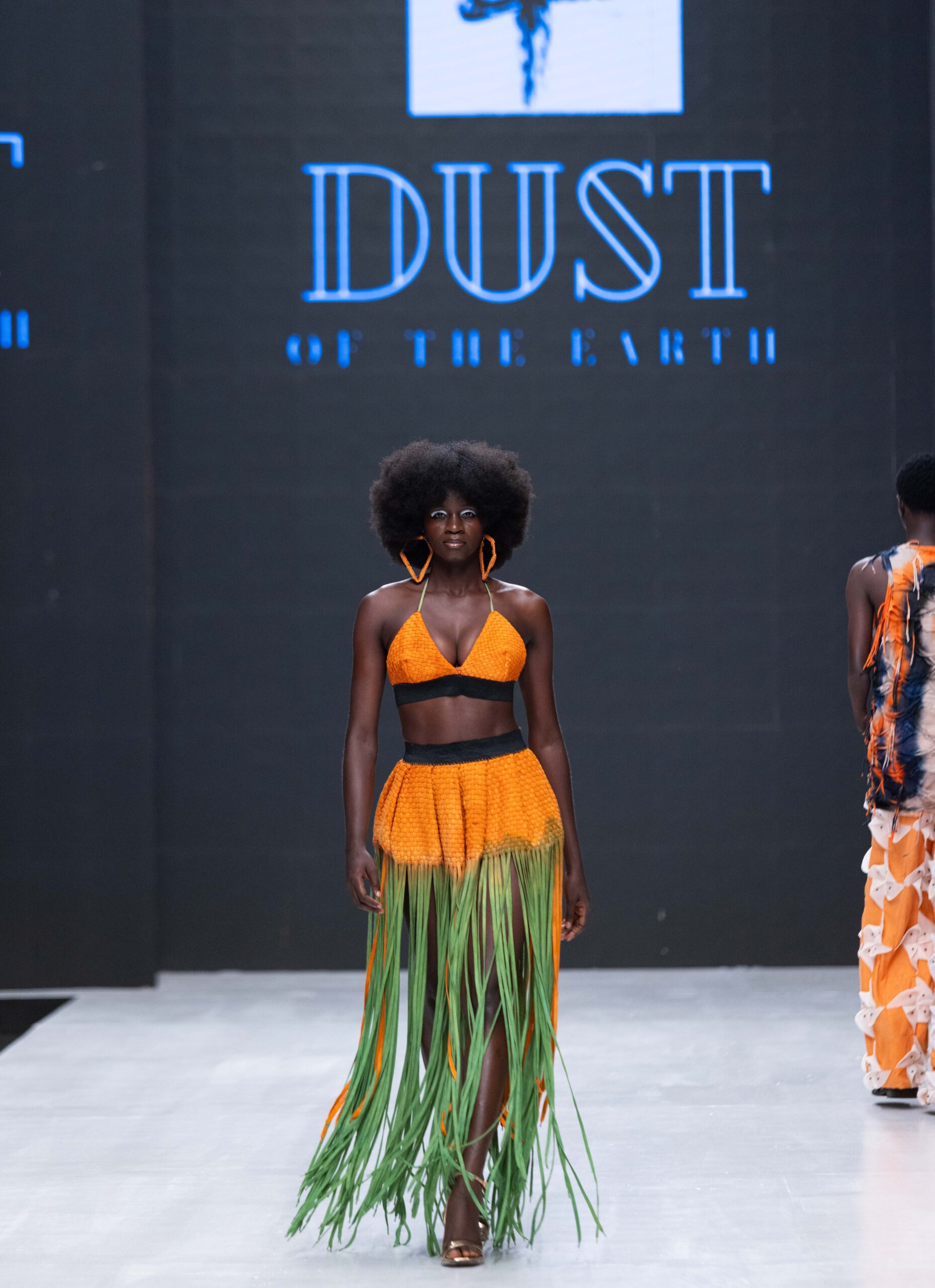 Models on Lagos Fashion Week 2024 runway, showcasing Nigerian designs with African textiles and vibrant street style.