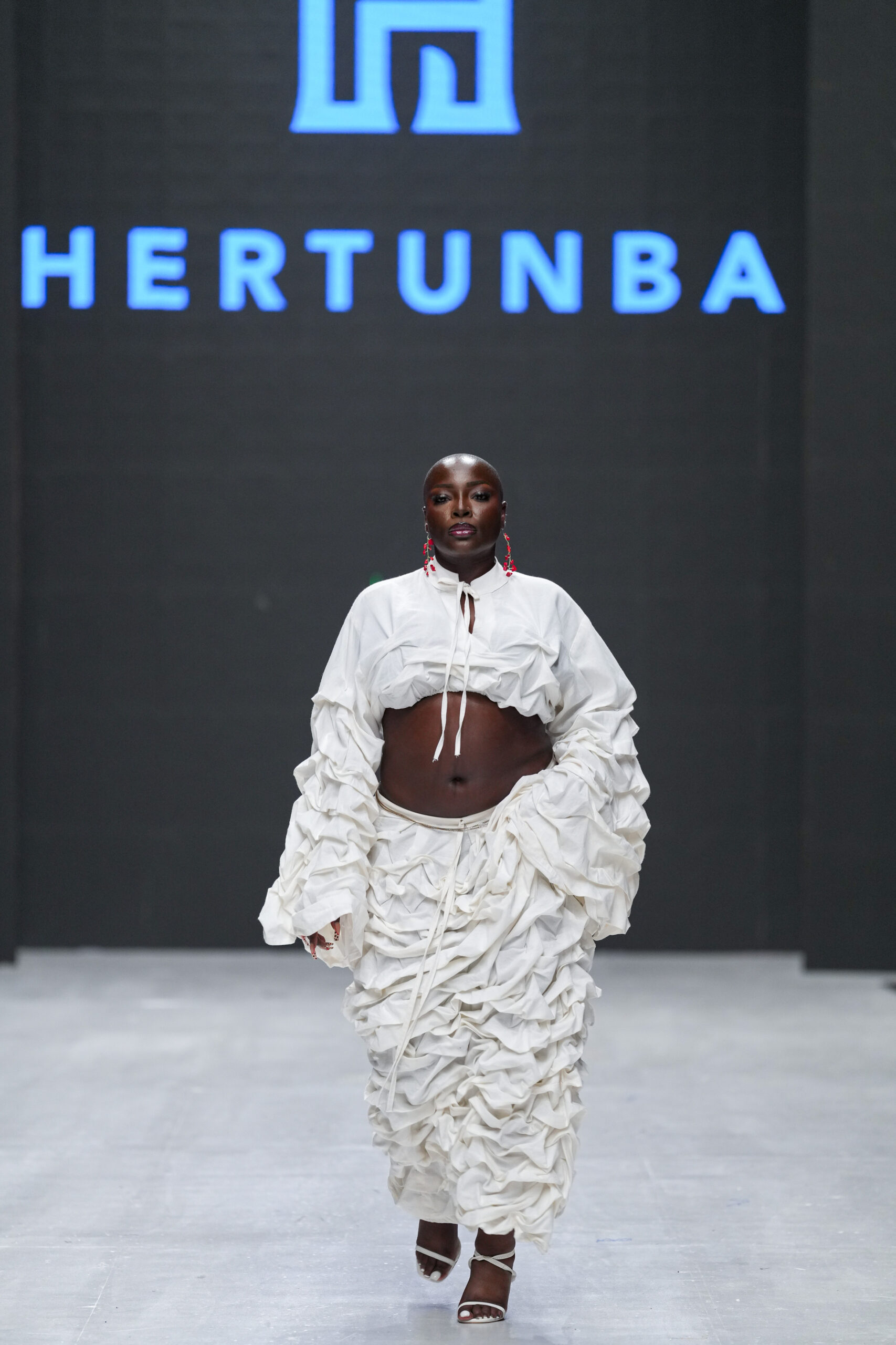 Models on Lagos Fashion Week 2024 runway, showcasing Nigerian designs with African textiles and vibrant street style.