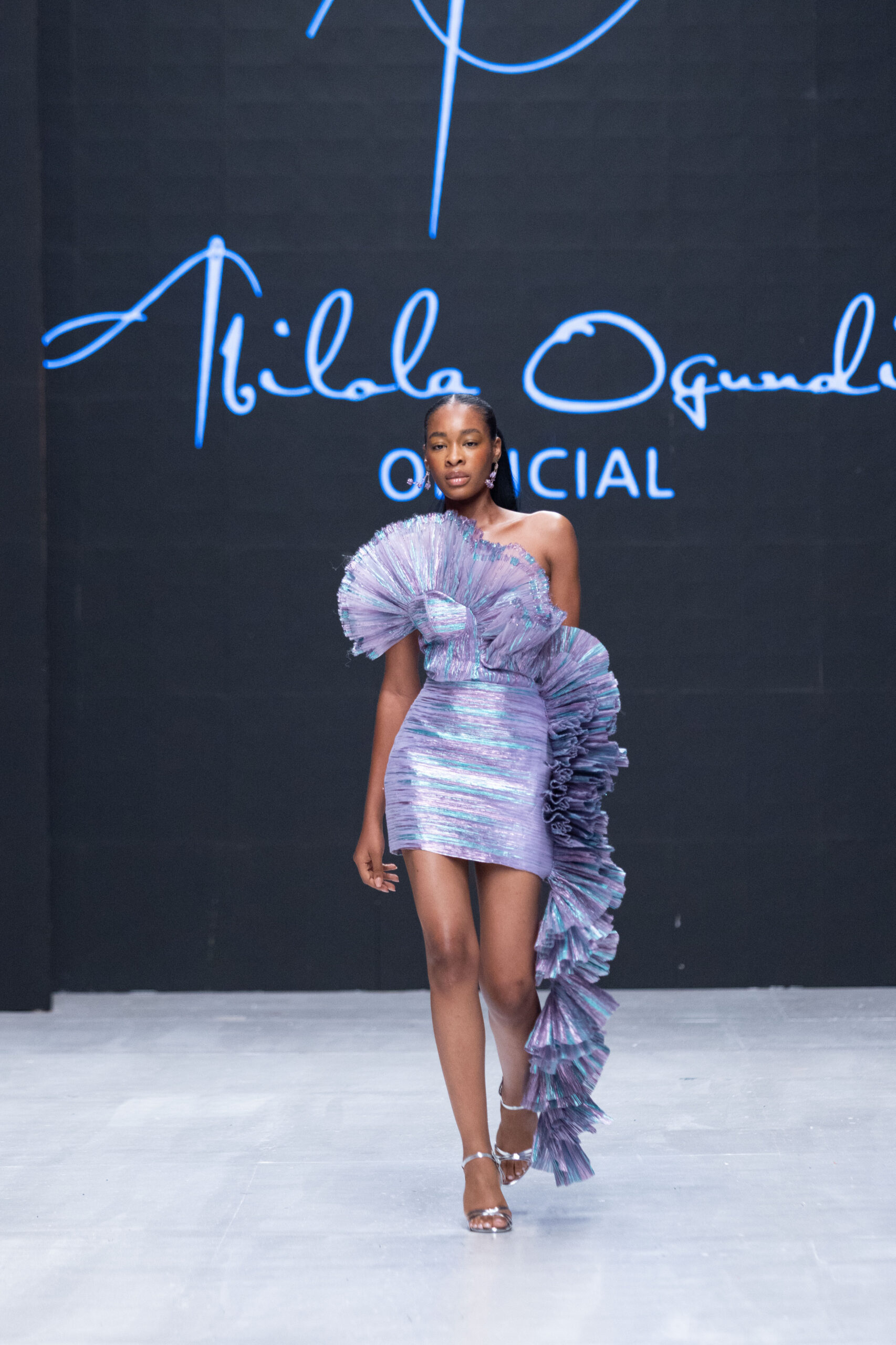 Models on Lagos Fashion Week 2024 runway, showcasing Nigerian designs with African textiles and vibrant street style.