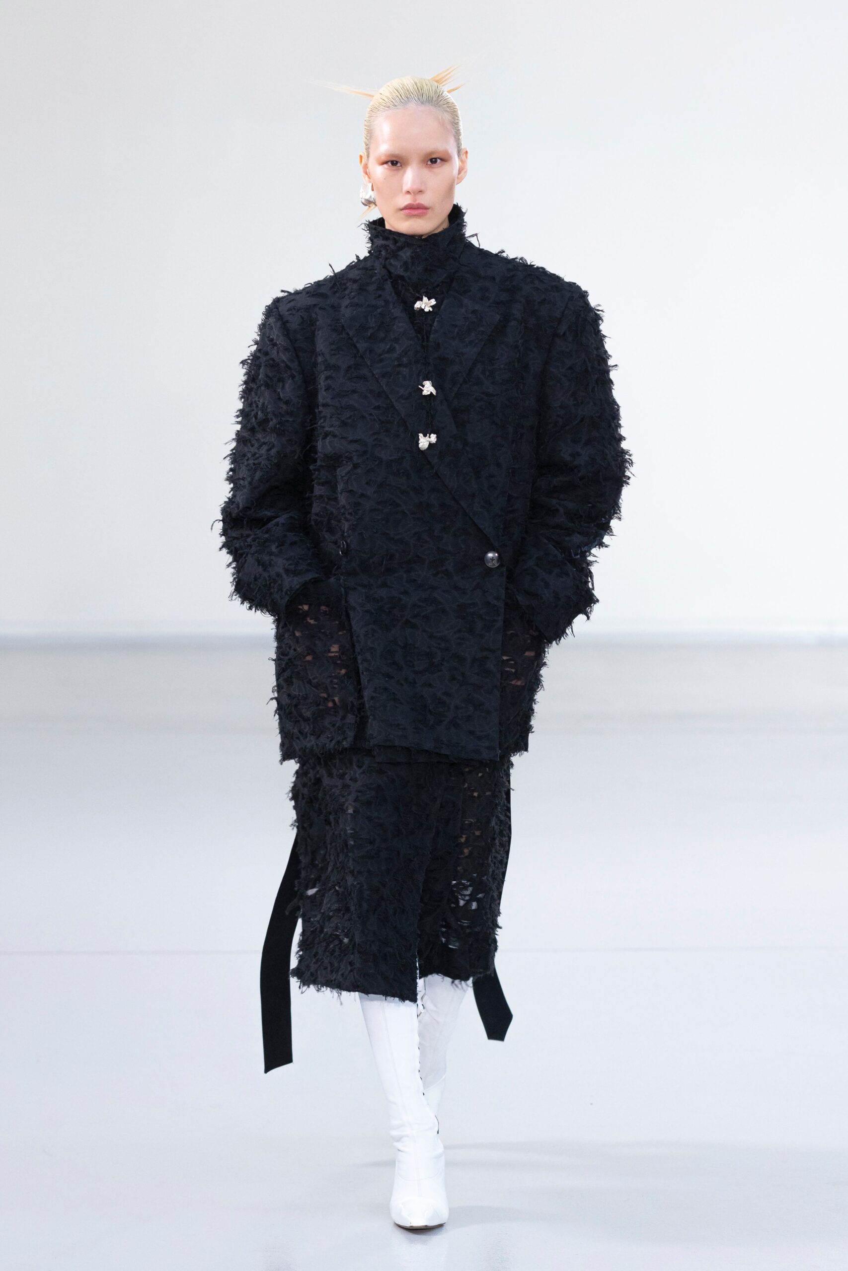 Emily Karaka’s artwork reimagined in Qasimi AW25 modular silhouettes