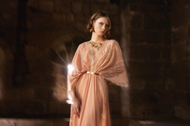 Model wearing Tony Ward Fall/Winter 2025 design in metallic hues. Of Silk and Steel fashion campaign showcasing luxury textures