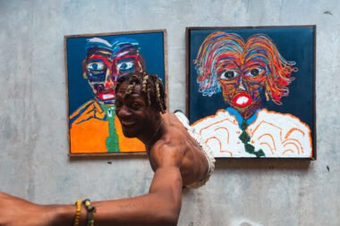 Selassie abstract painting with bold colours and stick figures