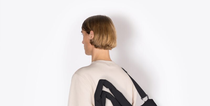 Close-up of Ucon Acrobatics Moss Series backpack showing padded texture and minimalist waterproof design.