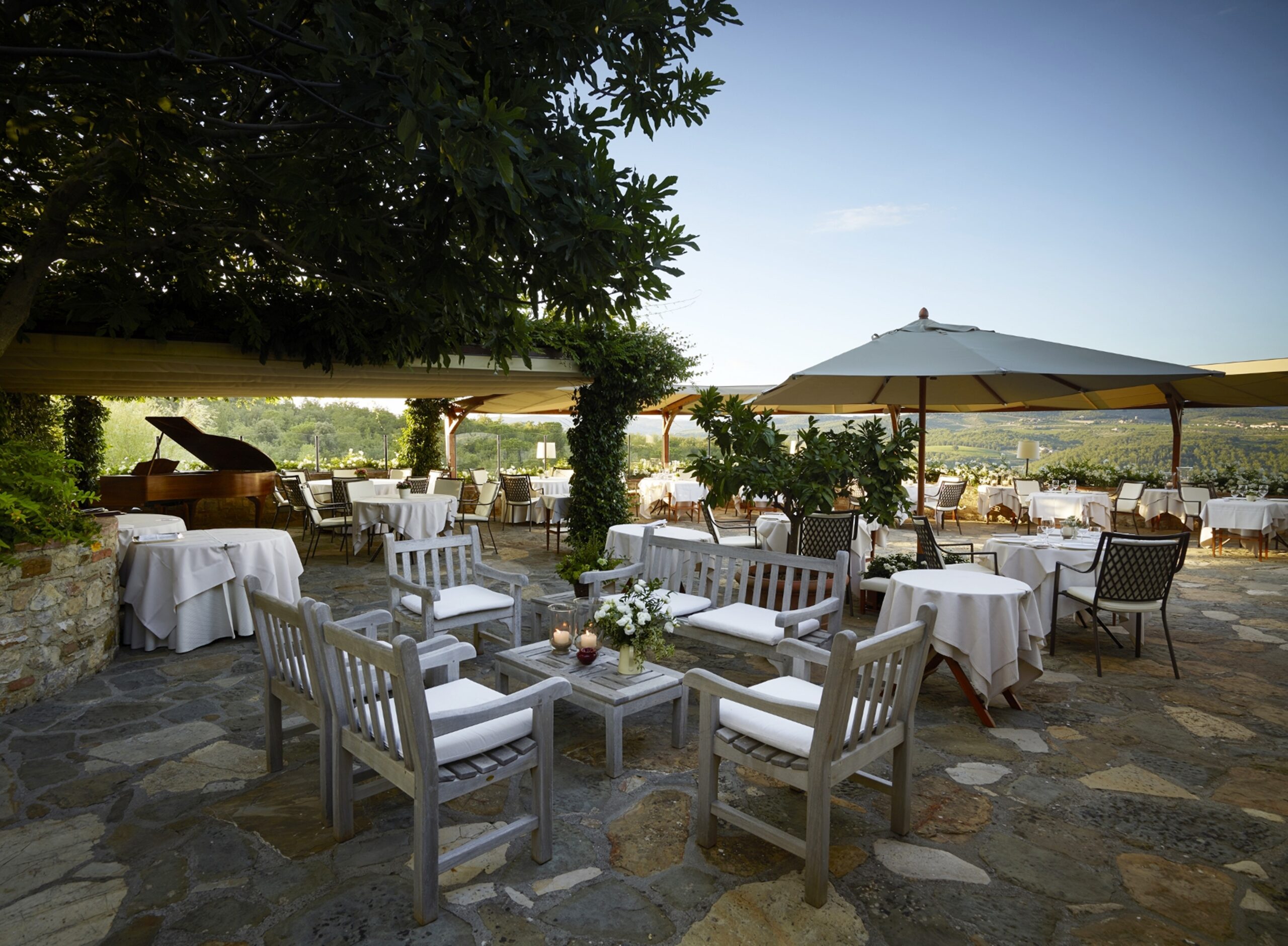 La Colonna restaurant at Hotel Le Fontanelle with panoramic views of the Tuscan hills in Chianti.
