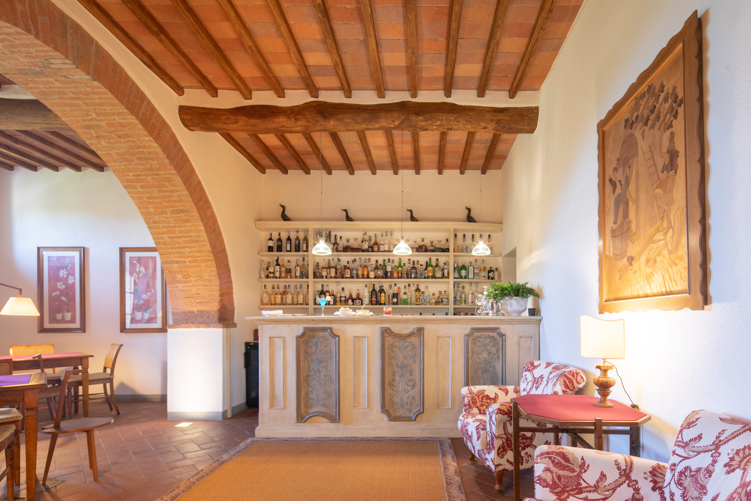 La Colonna restaurant at Hotel Le Fontanelle with panoramic views of the Tuscan hills in Chianti.
