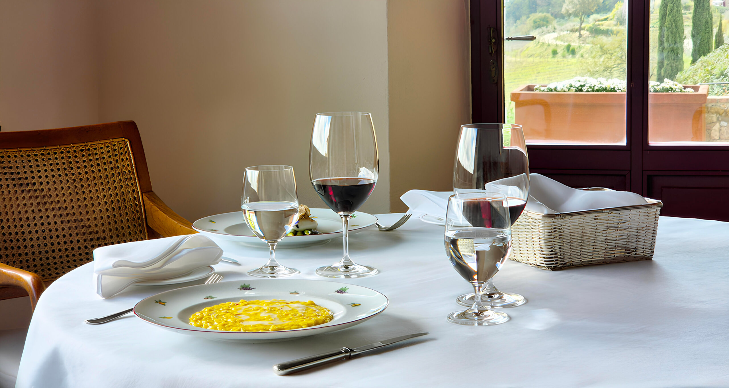 La Colonna restaurant at Hotel Le Fontanelle with panoramic views of the Tuscan hills in Chianti.