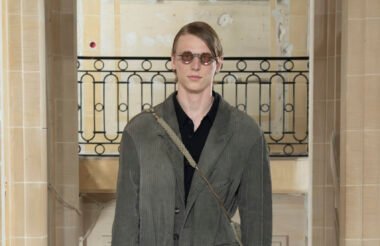 Model wearing Ziggy Chen SS26 Pritrike Collection, dressed in earth-toned garments made from natural fibres and primal-inspired prints