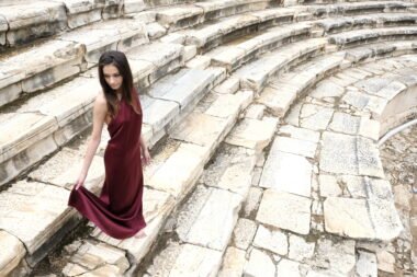 Model wearing Aelis Couture FW25/26 red couture dress inspired by Hierapolis and emotional storytelling.