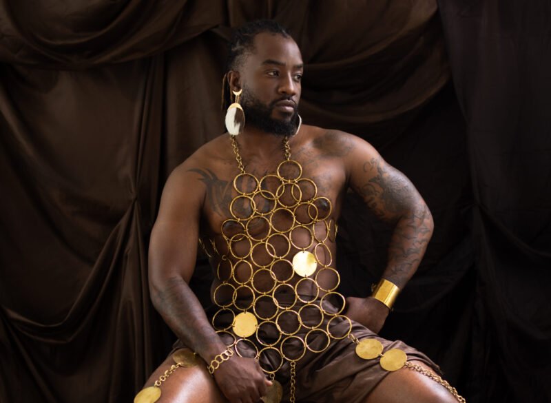 Kenyan jewellery designer Gandani Carlton styling a brass necklace