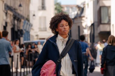 Camiel Fortgens SS26 collection models walk Paris streets with speakers, showcasing sun-faded garments and deconstructed details