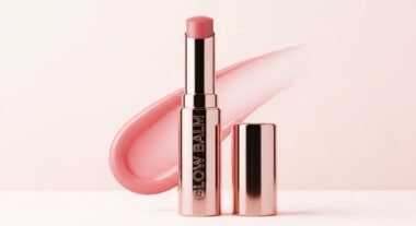 Winter 2025 beauty products flat lay with moisturizers, lip oils, and frosted makeup tones