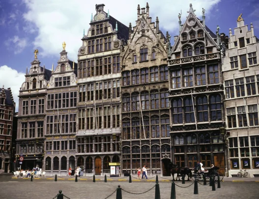 Stylish traveler exploring fashion capitals in 2026 including Antwerp, Lagos, Tokyo, and Copenhagen