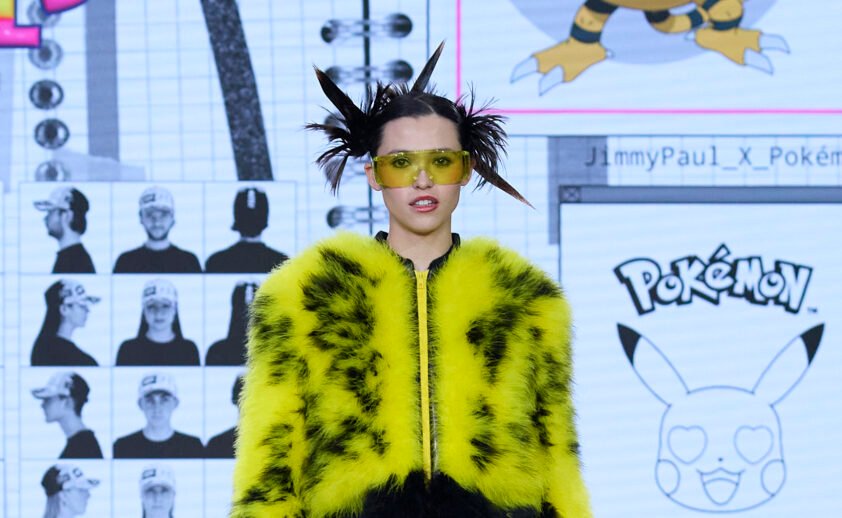 Model walking the runway in JIMMYPAUL x Pokémon collection featuring Pikachu-inspired fashion look