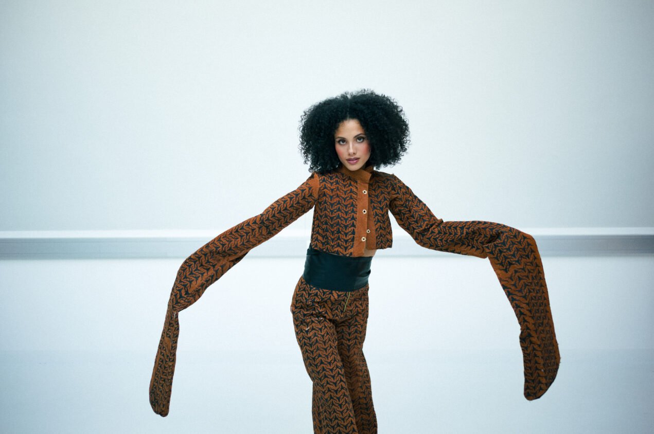 Contemporary African fashion editorial showcasing structured barkcloth tailoring and sculptural silhouettes