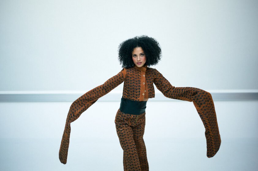 Contemporary African fashion editorial showcasing structured barkcloth tailoring and sculptural silhouettes