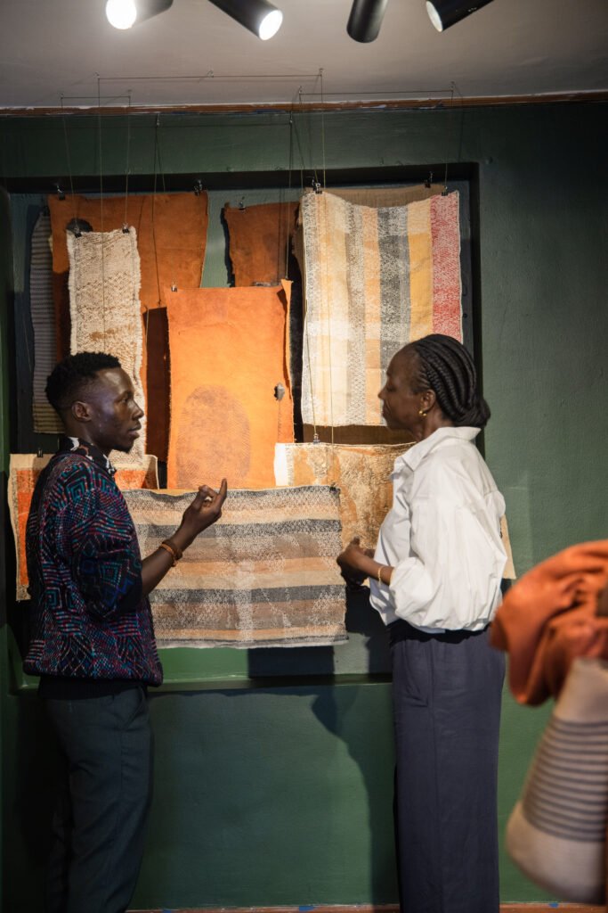 Kajebe Jacob presenting his contemporary artwork at "The Quiet Thud of Falling Trees" exhibition, curated by Nicole Remus